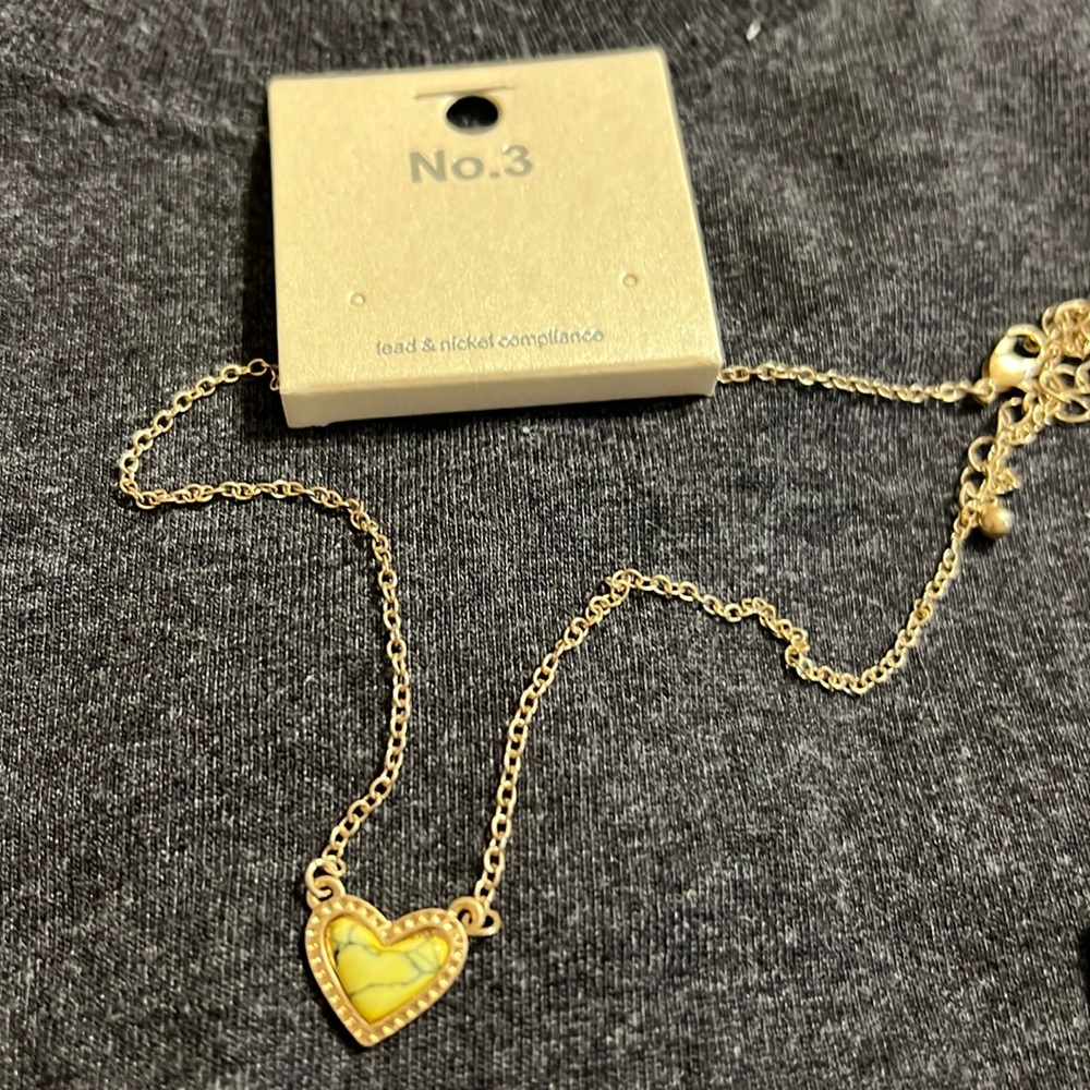 Yellow heart necklace with tiny streaks of black